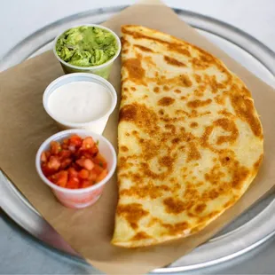 quesadilla and guacamole on a plate