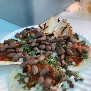 a plate of beans and onions