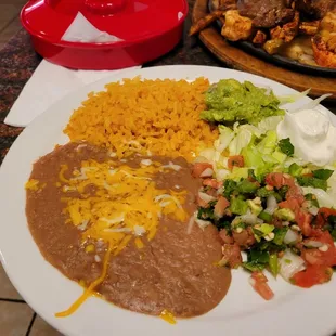 Refried Beans, Rice, Pico, Sour cream, and guac