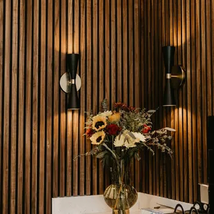  a vase of flowers on a counter