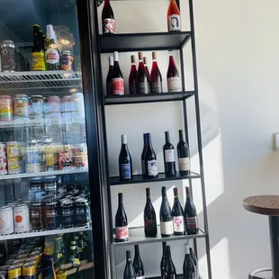 a shelf of wine bottles