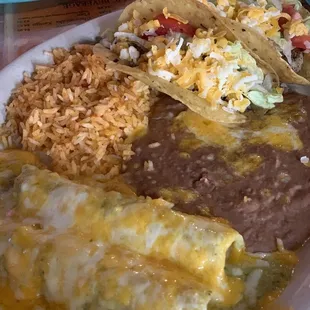 Cheese enchiladas with green sauce. Tacos. Rice and beans