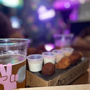 a box of doughnuts and a glass of beer