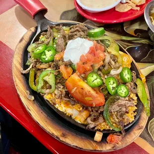 Fajitas enchiladas steak.  Added fresh jalapeños.