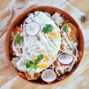 an overhead view of a bowl of food