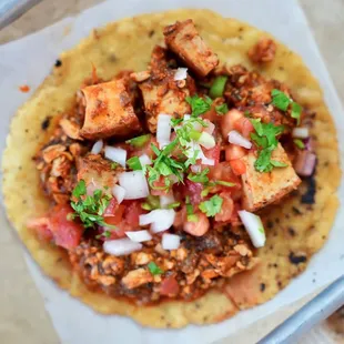 a taco with meat and onions