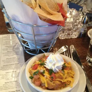 Four Corners Bean con Queso (Blend of Cheeses, Tomatoes, Leeks &amp; Green Chili, Pinto Beans. Pico De Gallo &amp; Sour Cream), $5.95