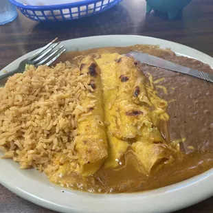 Cheese enchilada can&apos;t remember what number meal I got, but it had taco, cheese puff, guacamole, two cheese enchiladas, beans and rice.