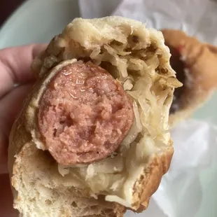 Sausage and sauerkraut kolache. Moist but not soggy, balanced, and look at all that good mustard in there! JUL23