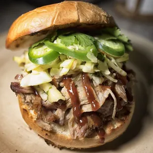 a pulled pork sandwich on a bun