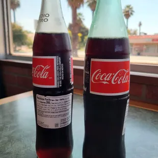 Mexican Coke, two different bottle colors too.