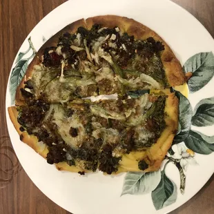 Vegan Flatbread with fresh pesto, sautéed onions and sausage