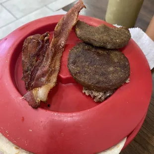 At least 2 day old sausage patty and old greasy bacon.