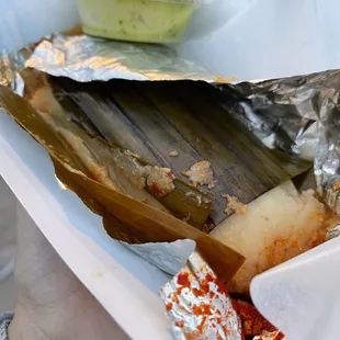 a person holding a plate of food