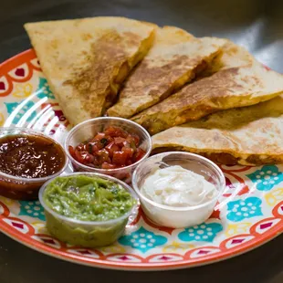 Grilled Quesadilla with side of Guacamole, Pico de gallo, Sour Cream, and Salsa