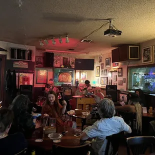 a group of people sitting around a table