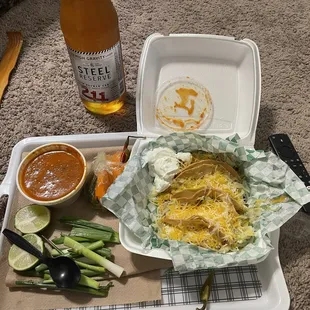 4 shredded beef tacos ,a large cup of several of their hot sauces mixed, pickled veggies, lime &amp; fresh green onions. Beer not included lol