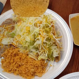 Chicken Tostada and Rolled Taco Plate (Rice and Beans) $10.95