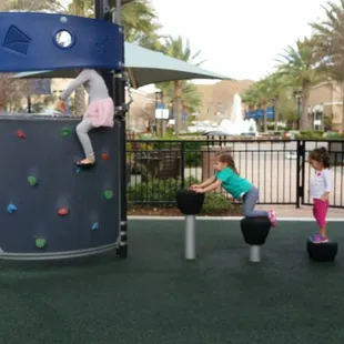 For budding climbers.  The summertime water spouts are just outside the gate, next to the fountain.
