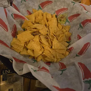 Basket of chips once we sat. A few on top were full-size chips, the majority were small pieces. Bottom of the bag?