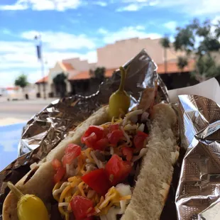 a hot dog with toppings