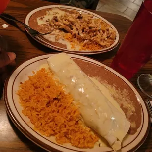 Chicken and veggie burrito with the chicken nacho&apos;s comes with side of beans and rice.