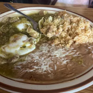 Huevos Rancheros w/Chile Verde, eggs over easy . Flour tortillas and their fresh squeezed orange juice (not pictured).