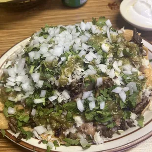 a plate of nachos on a table