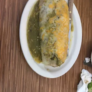 a plate of enchiladas and a bowl of salsa
