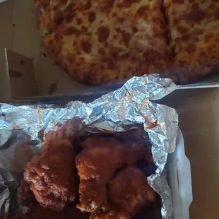 Pepperoni pizza with extra cheese and spicy wings