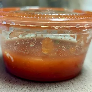 sauce in a plastic container