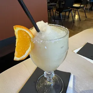 a margarita with an orange slice