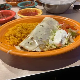 Lunch burrito Mexicano with a side of sour cream