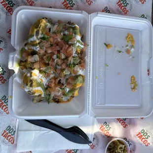 Asada Potato! Big portion, meat, cheese, toppings and jalapeño in the side.