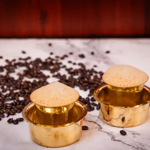 two cups of coffee and coffee beans