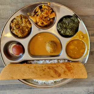 Vegetarian Thali with Masala Dosa (rice crepe with potato filling).