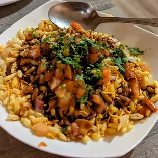 a plate of food with a spoon