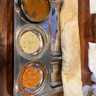 Cheese masala dosa, chutney and sambhar.