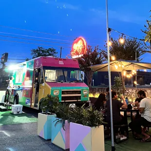 a colorful food truck parked in a parking lot