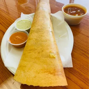 Masala Dosa - thin rice and lentil crepe filled with potato masala.
