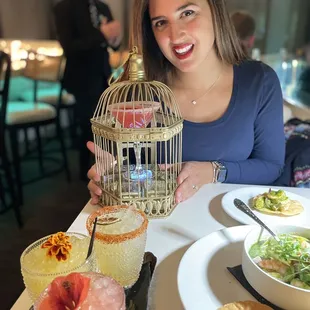 "The Kylie" sweet and spicy, visually impressive drink! Served in a glowing golden bird cage too!