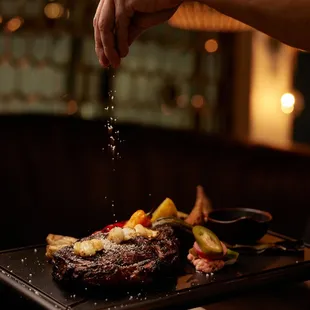 BONE-IN TOMAHAWK RIBEYE sous vide, grilled to order, jalapeño chimichurri, foyat