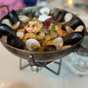 DOSALAS PAELLA shrimp, clams, mussels, pulled chicken, chorizo, saffron rice, sofrito, roasted tomato, microgreens