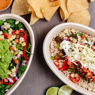 two bowls of mexican food with tortillas and guacamole