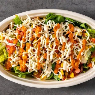 A hearty mix of rice, beans, juicy meats, fresh veggies, and toppings, all in one bowl. Flavor-packed and satisfying!