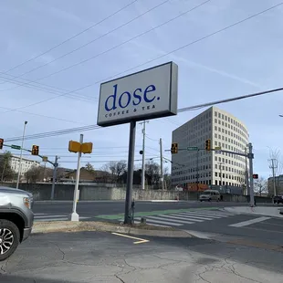 a street corner with a sign that says dose