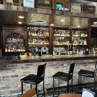  a bar with a brick wall