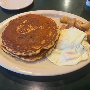 a plate of pancakes and eggs