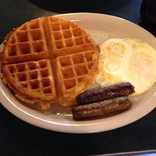 Waffle Combo with sausage and fried eggs.