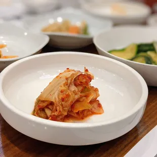 Portrait mode close-up of our kimchi. Part of the banchan that came with our sushi lunch. Korean side dishes.